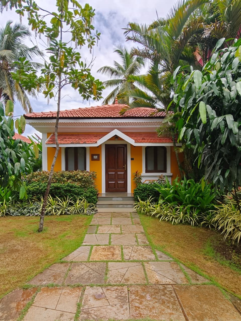 Orange Portuguese-style villa at Mercure Goa Devaaya