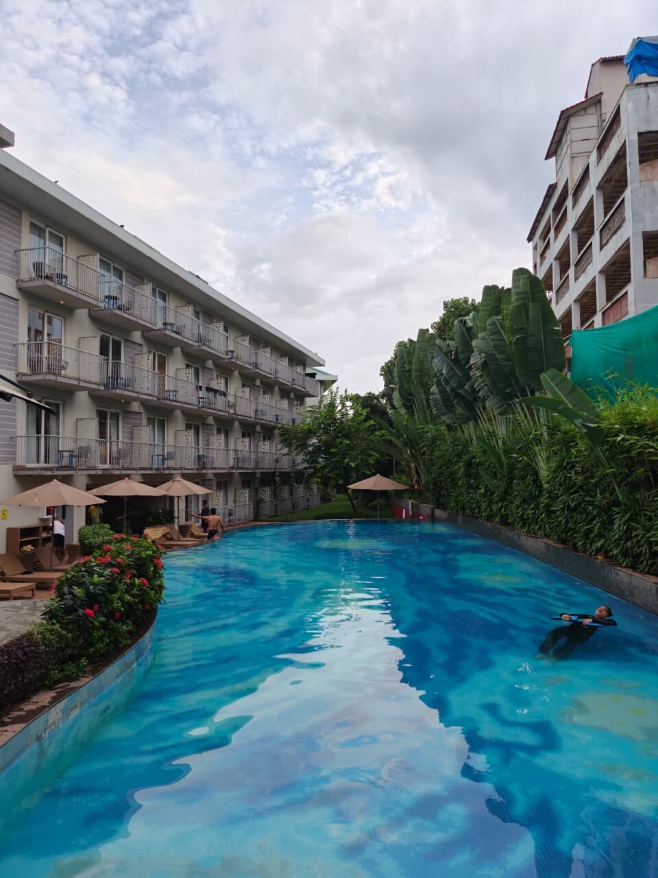 Pool at ibis Styles Goa Vagator, with the hotel building behind it