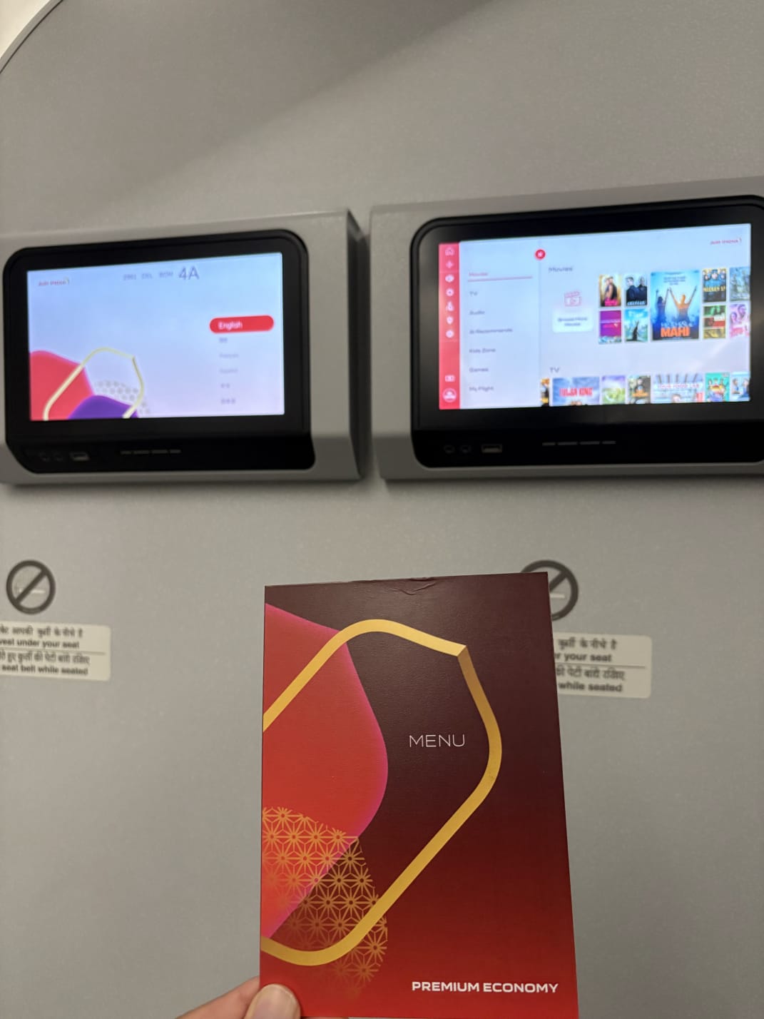 Air India Premium Economy menu card in front of the seat screens