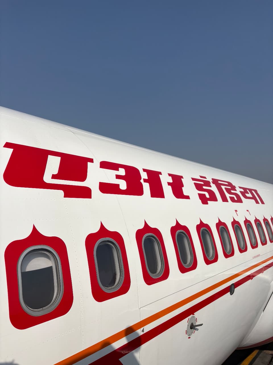 Close-up of Air India Hindi livery and aircraft windows